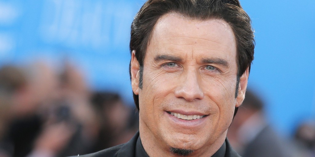 John Travolta poses as he arrives for the screening of "Killing Season", Friday, Sept. 6 , 2013, at the 39th American Film Festival, in Deauville, Normandy, western France. (AP Photo/Lionel Cironneau)